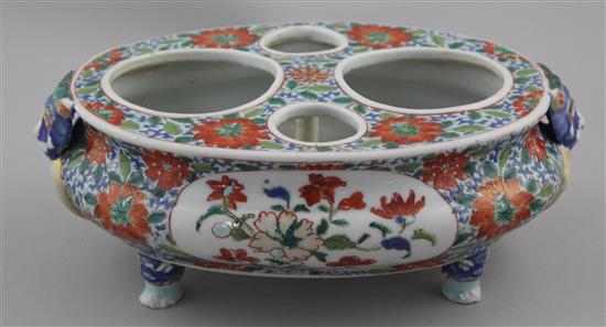 A rare and unusual Chinese Export famille verte oval desk stand, early 18th century, 25.5cm, one foot repaired